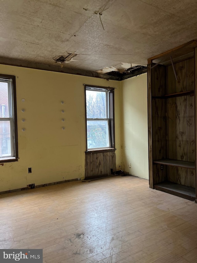 unfurnished room featuring light wood-type flooring