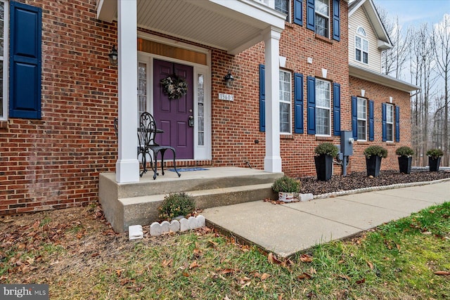 doorway to property featuring a porch