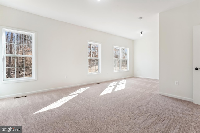 empty room featuring light colored carpet