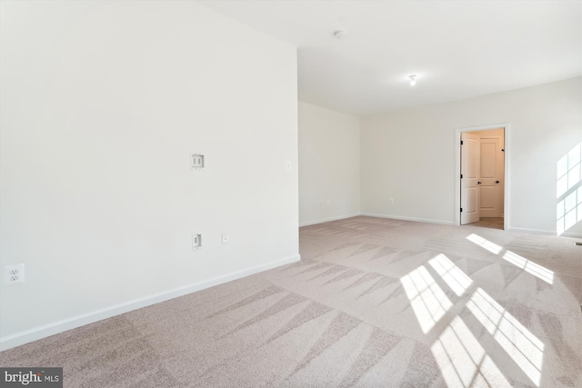 empty room featuring light colored carpet