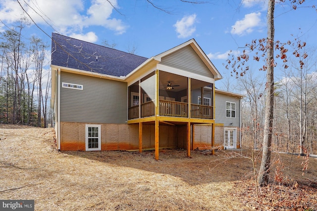 back of house with french doors, ceiling fan, and a sunroom