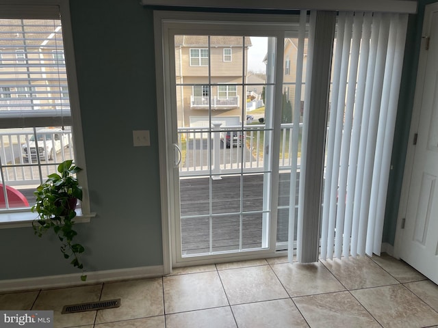 entryway featuring light tile patterned floors