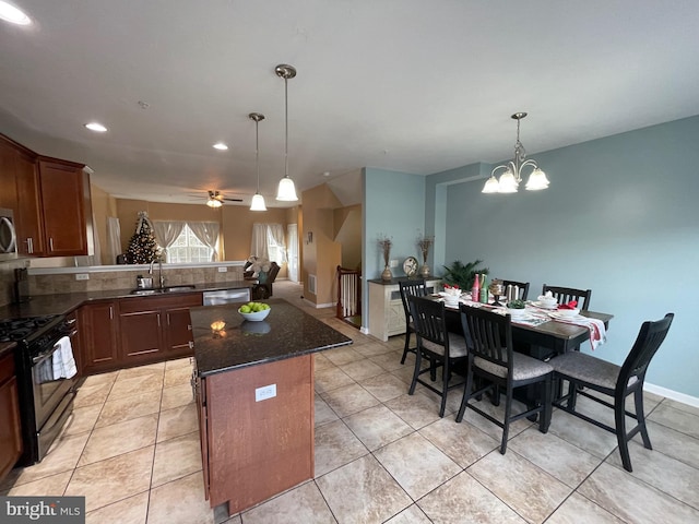 kitchen with dishwasher, ceiling fan with notable chandelier, sink, hanging light fixtures, and gas stove