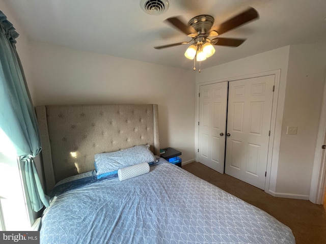 bedroom with ceiling fan and a closet