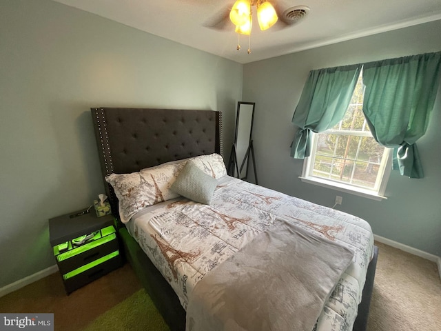 bedroom with ceiling fan and carpet floors