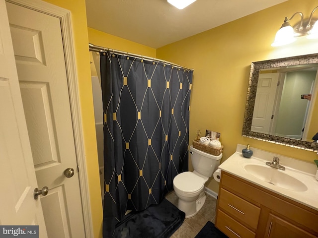 bathroom with tile patterned floors, a shower with curtain, vanity, and toilet