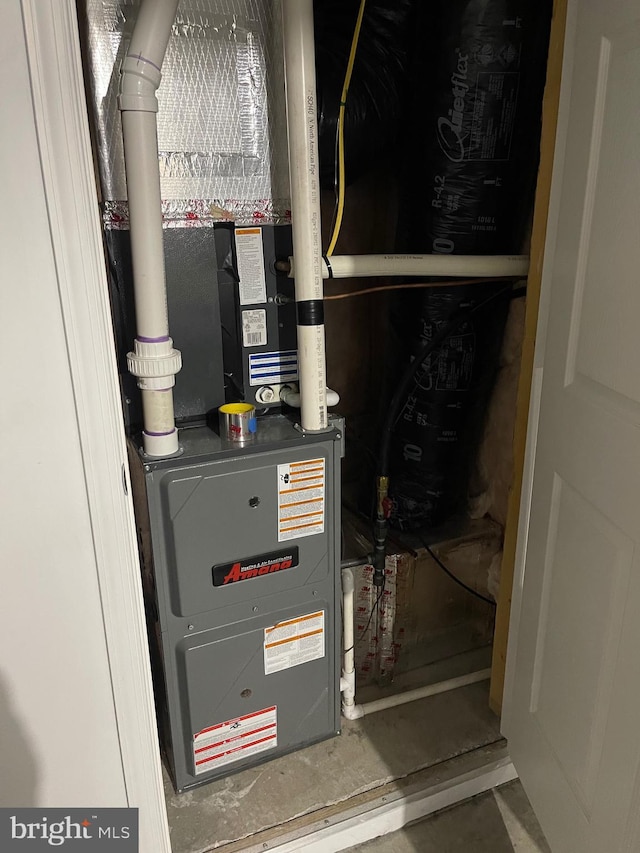 utility room with heating unit