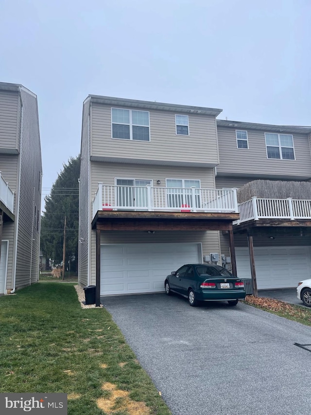 view of front of home featuring a garage and a front lawn