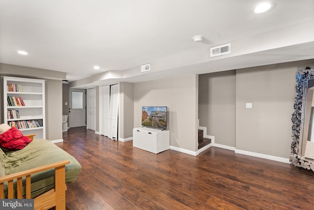 sitting room featuring dark wood-type flooring