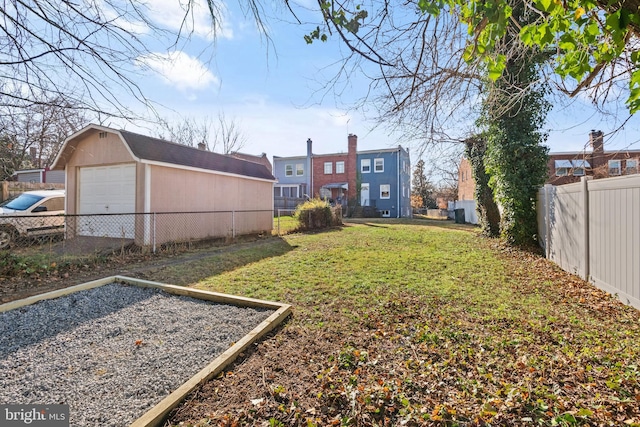 view of yard with an outbuilding and a garage