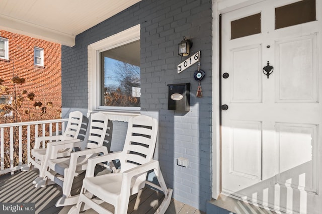 doorway to property featuring a porch