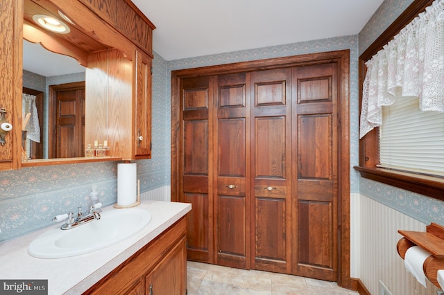 82 Quarry Rd, Birdsboro, PA 19508 - bathroom featuring wallpapered walls, vanity, and a closet