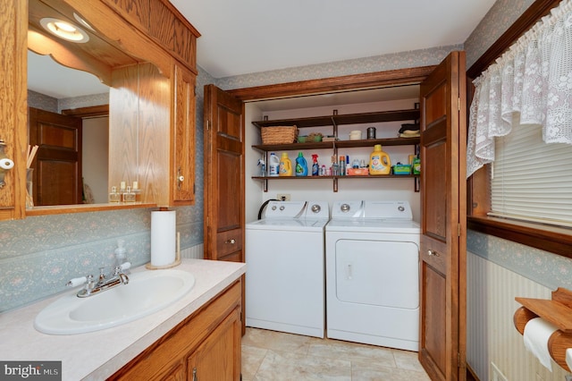 laundry room featuring washer and dryer and sink