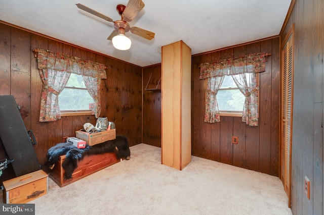 82 Quarry Rd, Birdsboro, PA 19508 - carpeted bedroom with wood walls and a ceiling fan