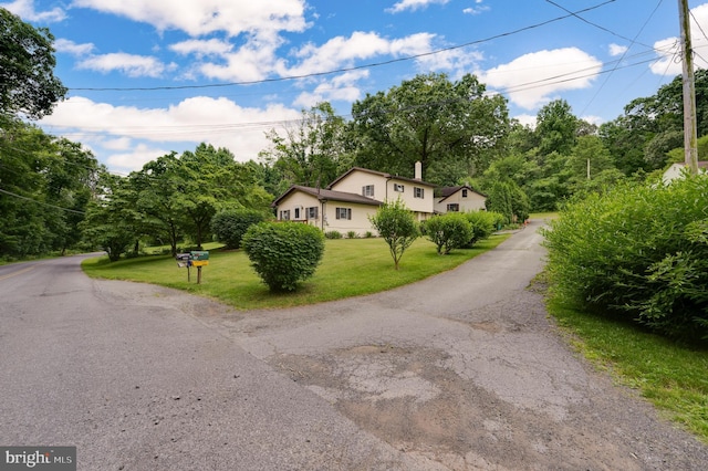 82 Quarry Rd, Birdsboro, PA 19508 - view of front of property with a front yard and view of wooded area
