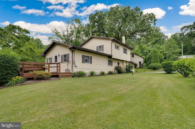 82 Quarry Rd, Birdsboro, PA 19508 - rear view of property featuring a chimney, a deck, and a yard