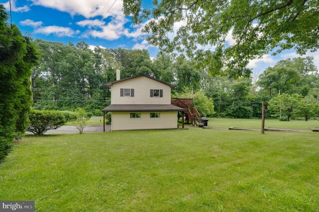 82 Quarry Rd, Birdsboro, PA 19508 - view of home's exterior with stairs, a yard, view of scattered trees, and a deck