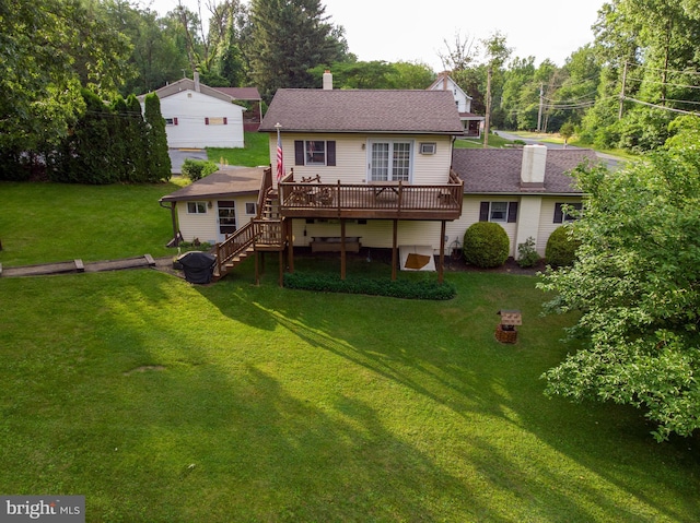 82 Quarry Rd, Birdsboro, PA 19508 - rear view of property featuring a wooden deck, a chimney, stairway, a lawn, and a shingled roof