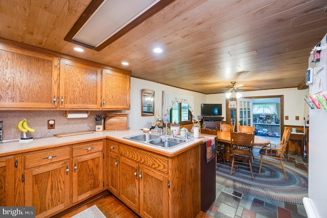 82 Quarry Rd, Birdsboro, PA 19508 - kitchen featuring a peninsula, wooden ceiling, light countertops, a ceiling fan, and brown cabinetry