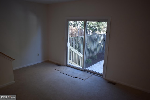 unfurnished room featuring carpet flooring