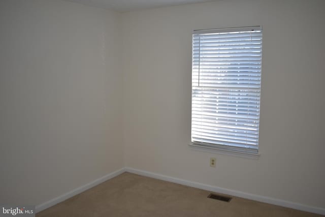 spare room featuring carpet flooring