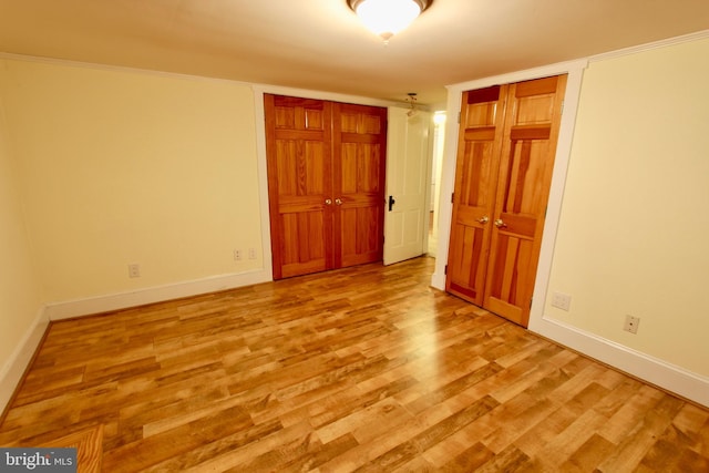 unfurnished bedroom with light hardwood / wood-style floors