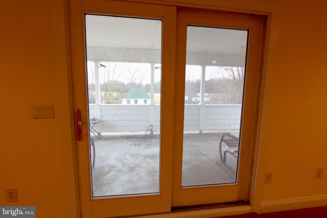 entryway featuring a wealth of natural light and french doors