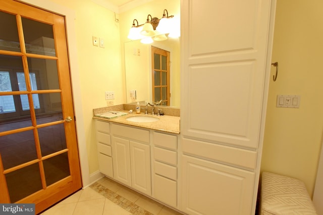 bathroom with tile patterned floors and vanity