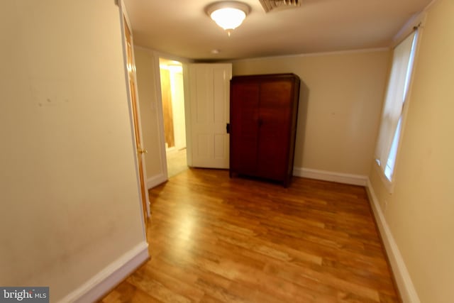 corridor featuring light hardwood / wood-style floors