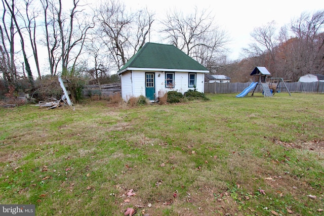 view of yard with a playground and an outdoor structure