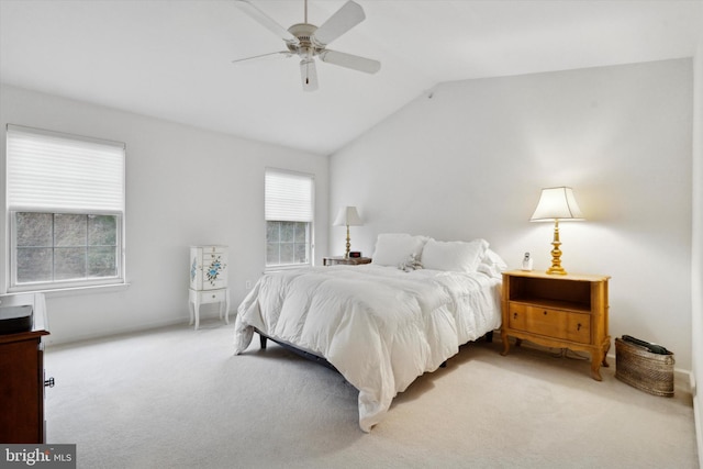 carpeted bedroom featuring ceiling fan and lofted ceiling