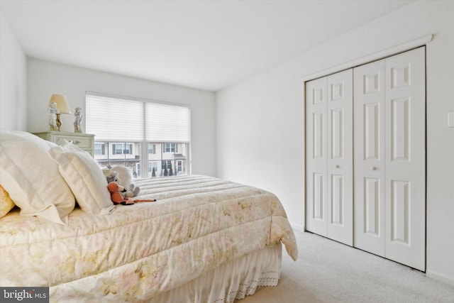 carpeted bedroom featuring a closet