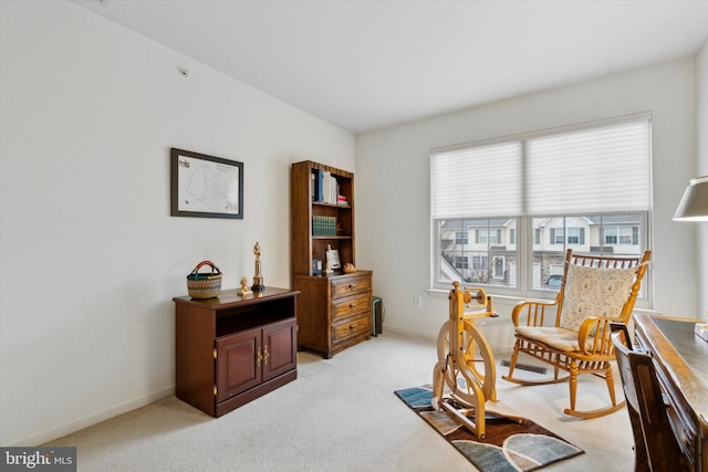 sitting room with light colored carpet