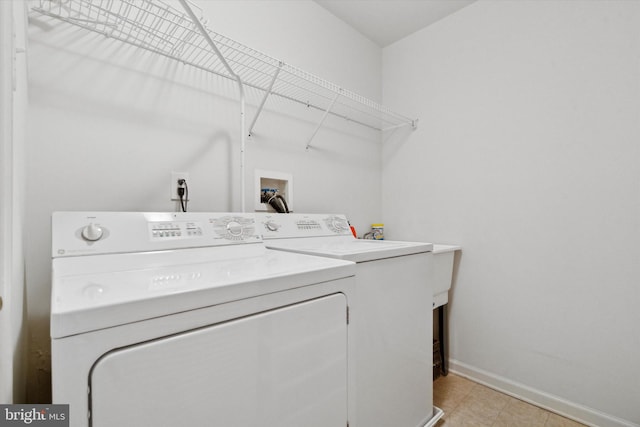 clothes washing area featuring washer and dryer