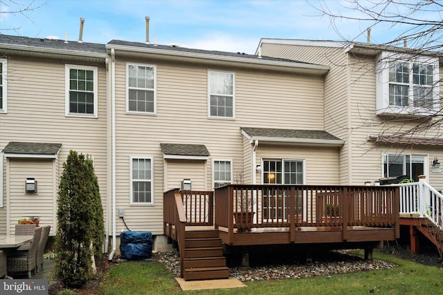 back of house featuring a wooden deck