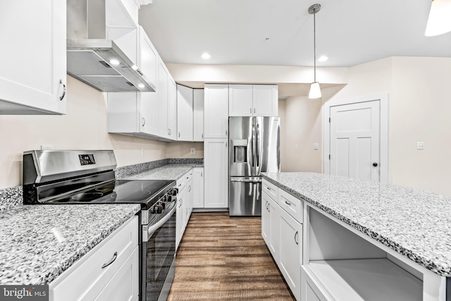 kitchen featuring pendant lighting, wall chimney range hood, dark hardwood / wood-style floors, appliances with stainless steel finishes, and white cabinetry