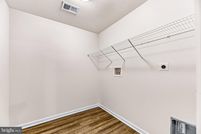 laundry room featuring hookup for an electric dryer, washer hookup, and hardwood / wood-style flooring