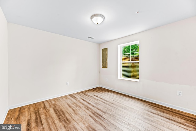 unfurnished room featuring light wood-type flooring