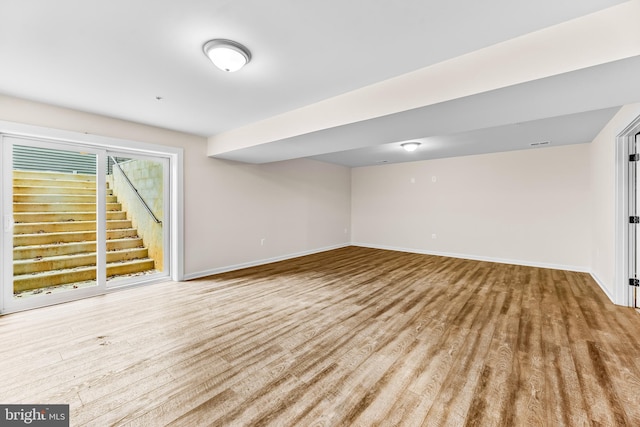 basement featuring light hardwood / wood-style flooring