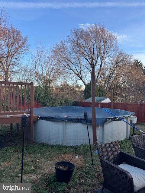 view of yard with a pool side deck