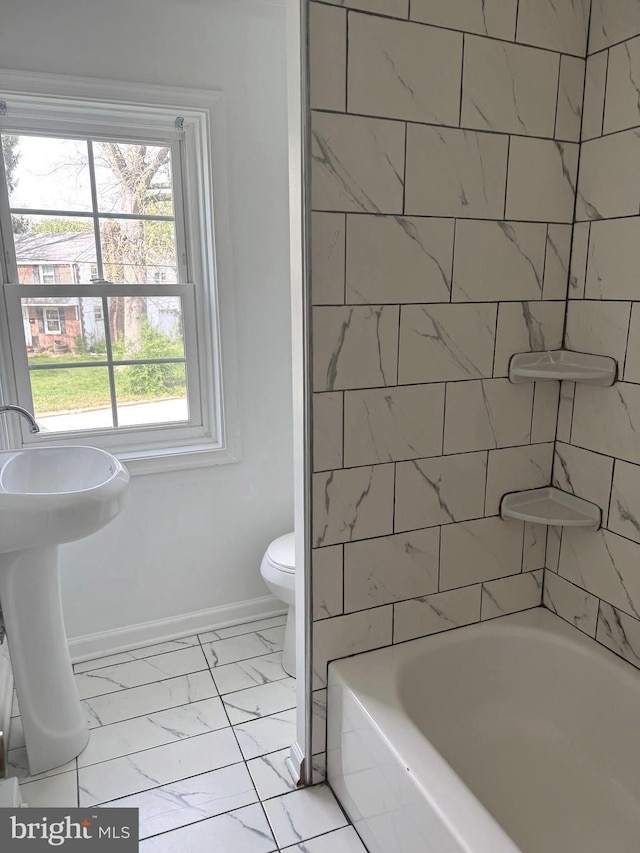 125 Rodney Dr, New Castle, DE 19720 - bathroom with marble finish floor, baseboards, and toilet
