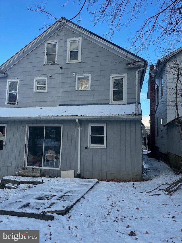 view of snow covered house