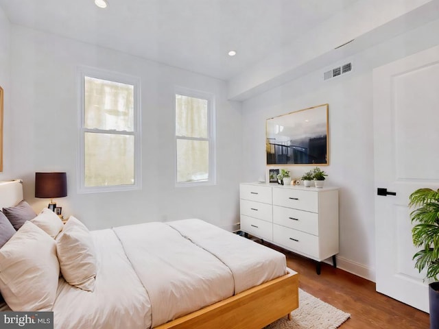 bedroom with hardwood / wood-style flooring