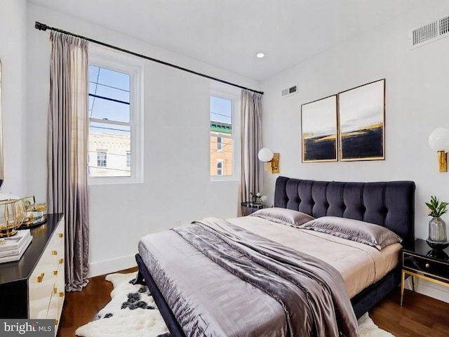 bedroom with hardwood / wood-style flooring