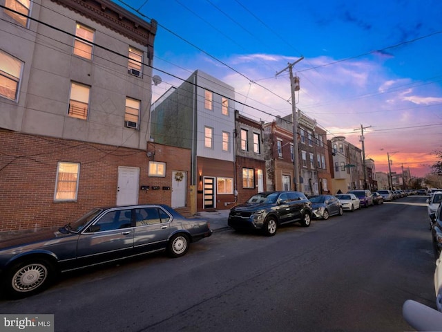 view of outdoor building at dusk