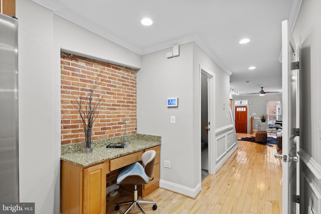 office area featuring ceiling fan, light hardwood / wood-style floors, and crown molding