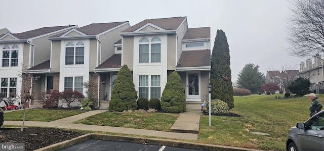 view of front of house featuring a front lawn