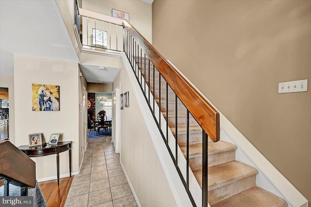 stairs with tile patterned floors