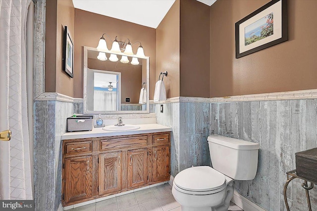 bathroom featuring tile patterned floors, vanity, and toilet