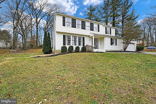 view of front facade with a garage and a front yard